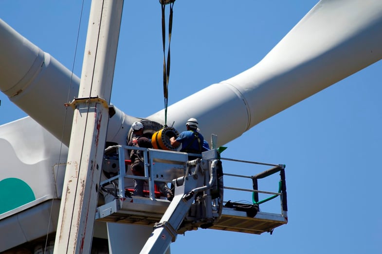 Two workers assembling wind turbine with ERAD Torque Wrench