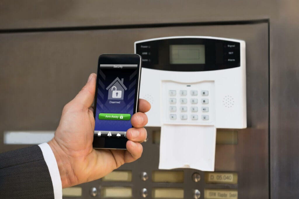 A person opening a keyless door lock through a smartphone